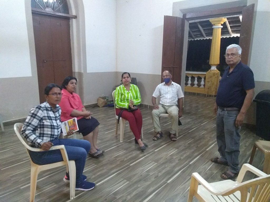 Volunteers meeting at a village community club