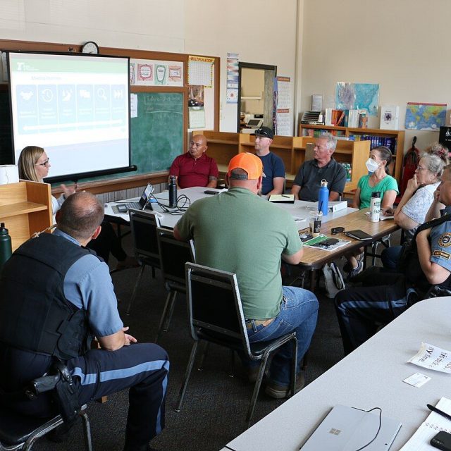 Project management team meeting around a conference table