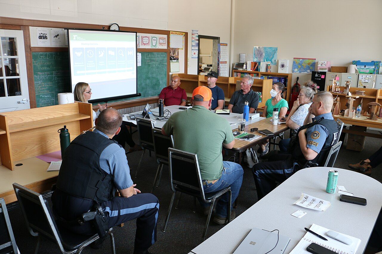 Project management team meeting around a conference table